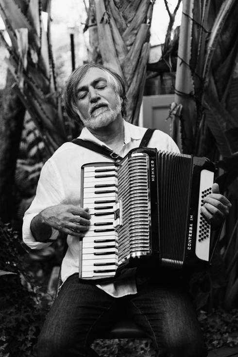 A person playing an accordion

AI-generated content may be incorrect.